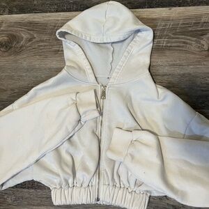 White cropped zipper hoodie.